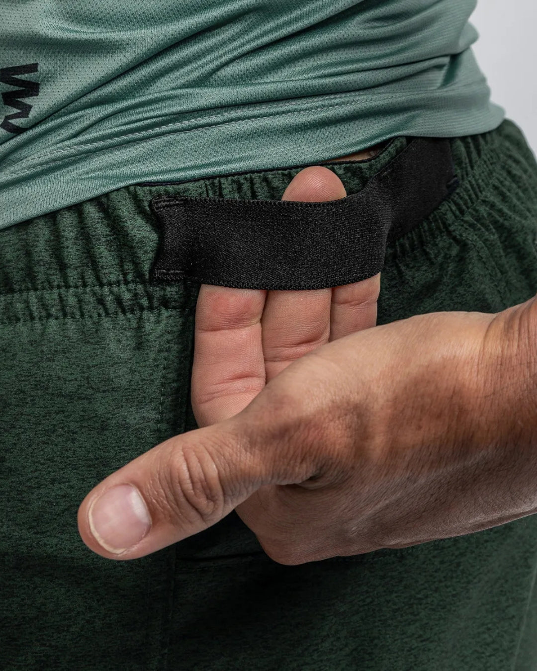 PANTALONETA RUNNING SUAREZ HYBRID DARK GREEN HOMBRE
